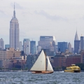 BESHERTE, a Buzzards Bay 18 built by Artisan Boatworks, Rockport, Maine, sails in New York with the backdrop of the Manhattan skyline