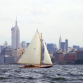 BESHERTE, a Buzzards Bay 18 built by Artisan Boatworks, Rockport, Maine, sails in New York with the backdrop of the Manhattan skyline