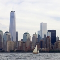 BESHERTE, a Buzzards Bay 18 built by Artisan Boatworks, Rockport, Maine, sails in New York with the backdrop of the Manhattan skyline