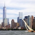 BESHERTE, a Buzzards Bay 18 built by Artisan Boatworks, Rockport, Maine, sails in New York with the backdrop of the Manhattan skyline