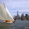 BESHERTE, a Buzzards Bay 18 built by Artisan Boatworks, Rockport, Maine, sails in New York with the backdrop of the Manhattan skyline