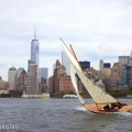 BESHERTE, a Buzzards Bay 18 built by Artisan Boatworks, Rockport, Maine, sails in New York with the backdrop of the Manhattan skyline