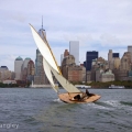 BESHERTE, a Buzzards Bay 18 built by Artisan Boatworks, Rockport, Maine, sails in New York with the backdrop of the Manhattan skyline