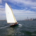 BESHERTE, a Buzzards Bay 18 built by Artisan Boatworks, Rockport, Maine, sails in New York with the backdrop of the Manhattan skyline