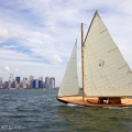 BESHERTE, a Buzzards Bay 18 built by Artisan Boatworks, Rockport, Maine, sails in New York with the backdrop of the Manhattan skyline